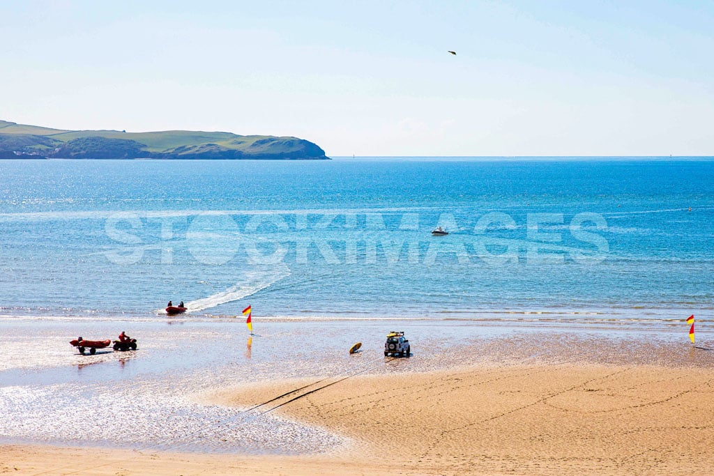 The RNLI set up for the day at Bigbury-on-Sea, Devon - one of the most popular beaches in the South West.