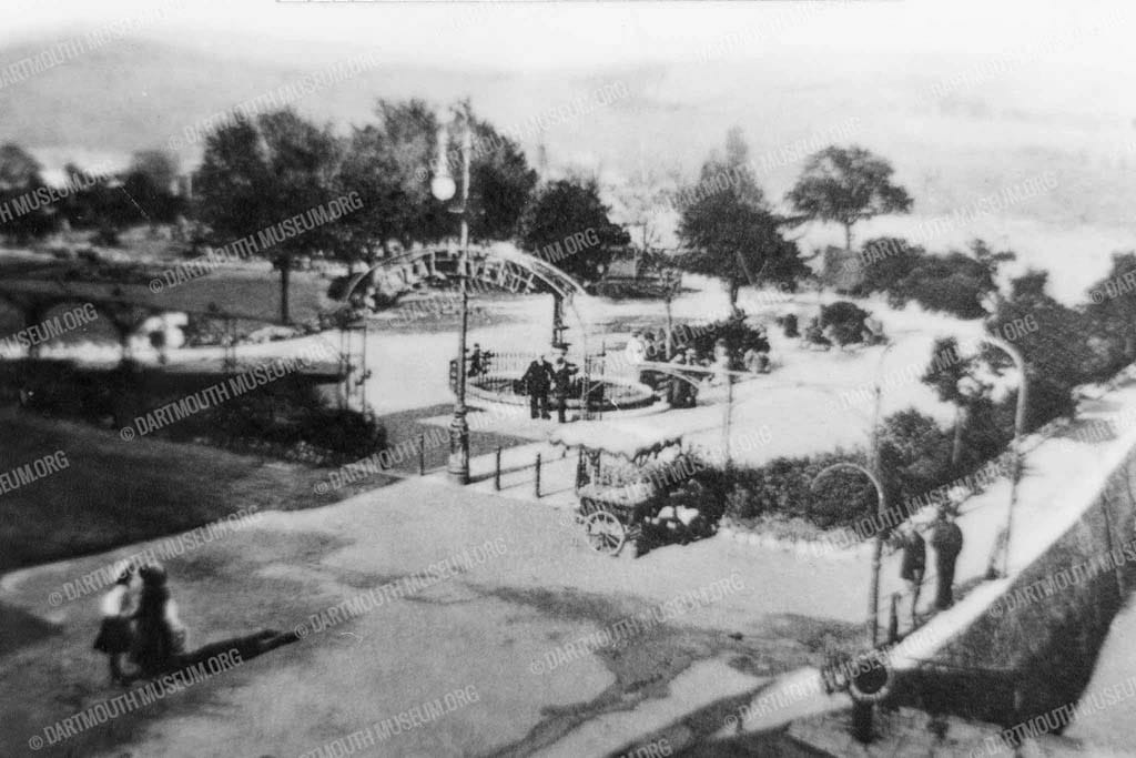 Historical photograph of Dartmouth's Royal Avenue Gardens in 1900 with two gentleman talking by the fountain.