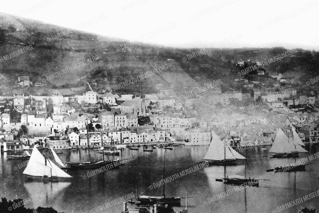 Historical photograph of Dartmouth Regatta Trawlers' racing in 1880, with Bayards Cove and Southtown in the background before the South Embankment was started.