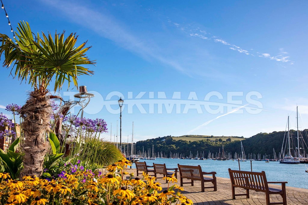 Summer scene vibrant with colour of our resident Pilgrim Statue looking out towards the mouth of the river along Dartmouth’s South Embankment.